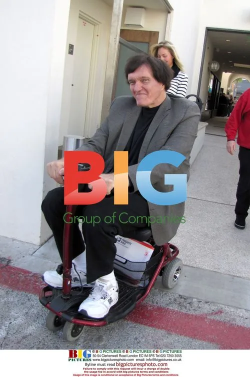 Jaws Riding Motorized Scooter in Beverly Hills
