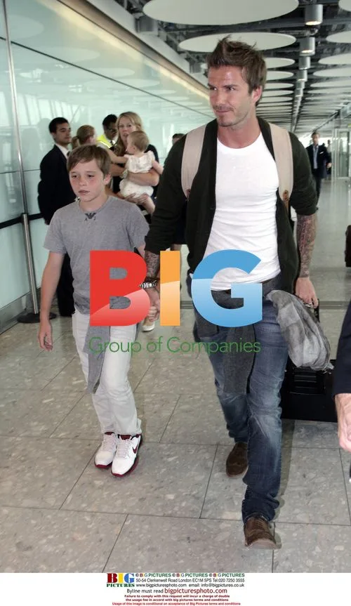 David and Brooklyn Beckham at London Airport