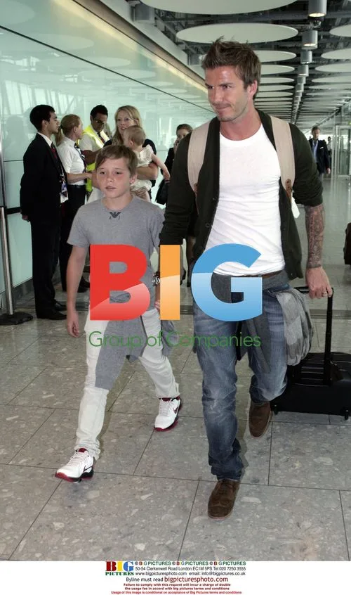 David Beckham and son Brooklyn at airport