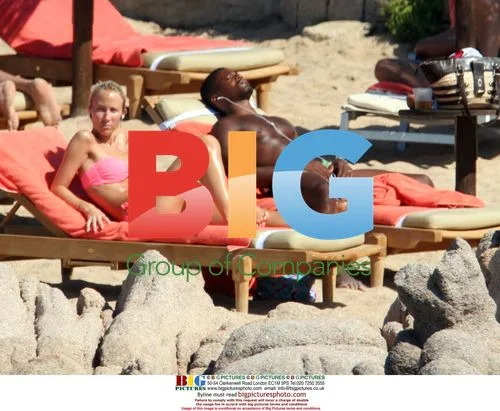 Patrice Evra relaxes with girlfriend