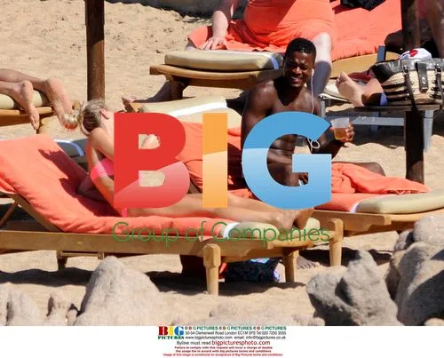 Patrice Evra relaxes with girlfriend