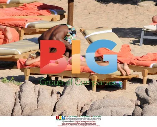 Patrice Evra relaxes with girlfriend