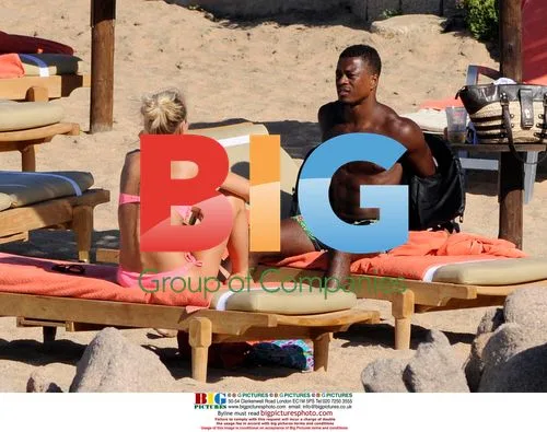 Patrice Evra relaxes with girlfriend ahead of Premier League season
