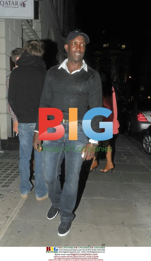 Dwight Yorke Leaving Hotel with Mystery Woman