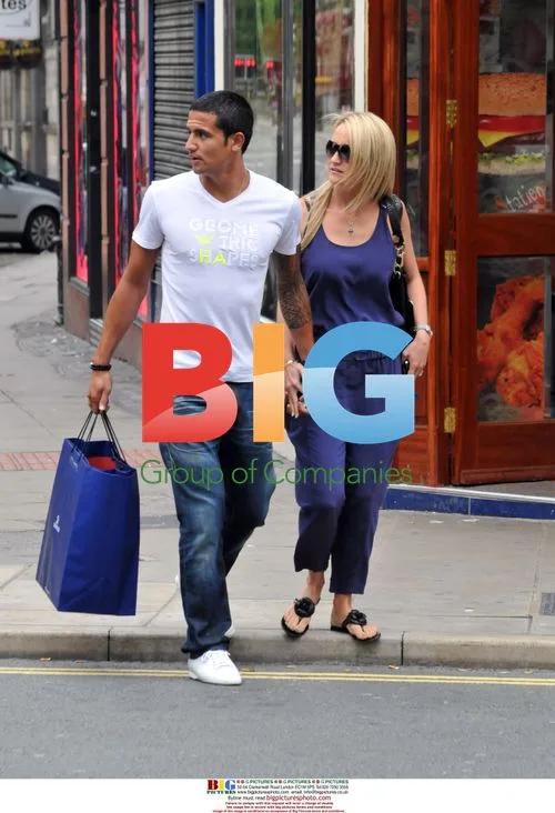 Everton Player Tim Cahill Shopping with Wife