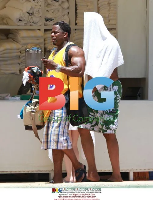 Dr Conrad Murray on beach with girlfriend