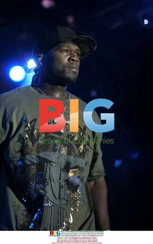 50 Cent performs on stage in Denver