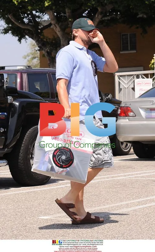 Leonardo DiCaprio Shops for Camera