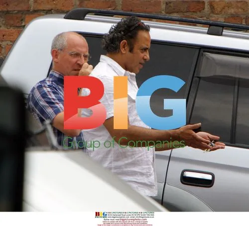 Corrie actor Jimmi Harkishin giving directions
