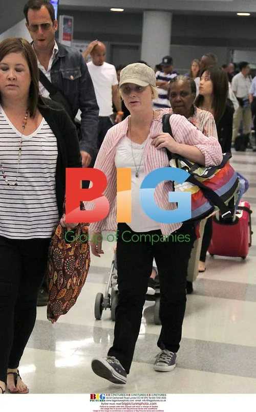 Amy Poehler and Will Arnett at JFK Airport