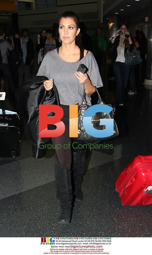 Khloe and Kourtney Kardashian at JFK