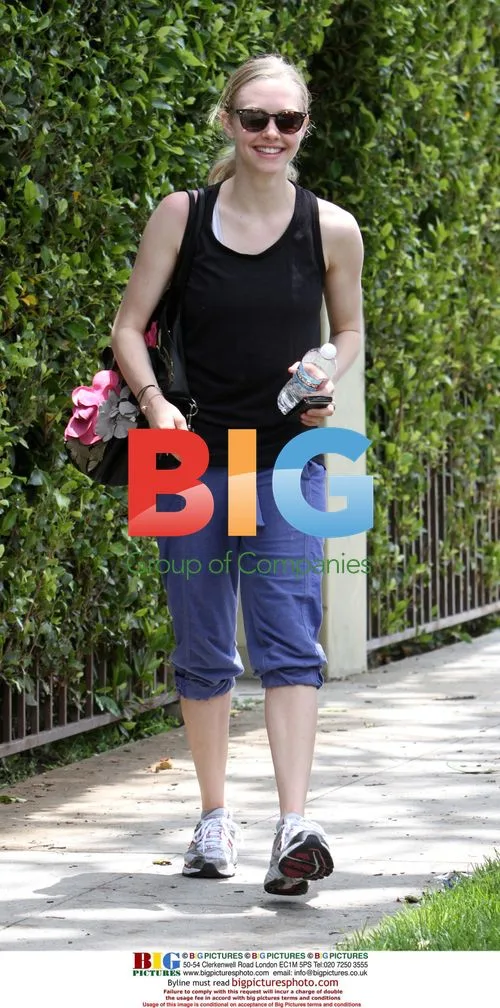 Amanda Seyfried takes coffee walk with dog