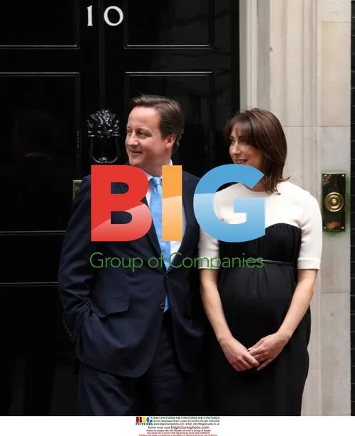 British PM David Cameron and wife Samantha await French president