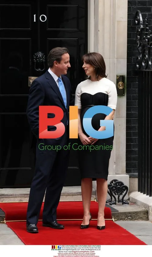 David Cameron and Samantha await Nicolas Sarkozy in London