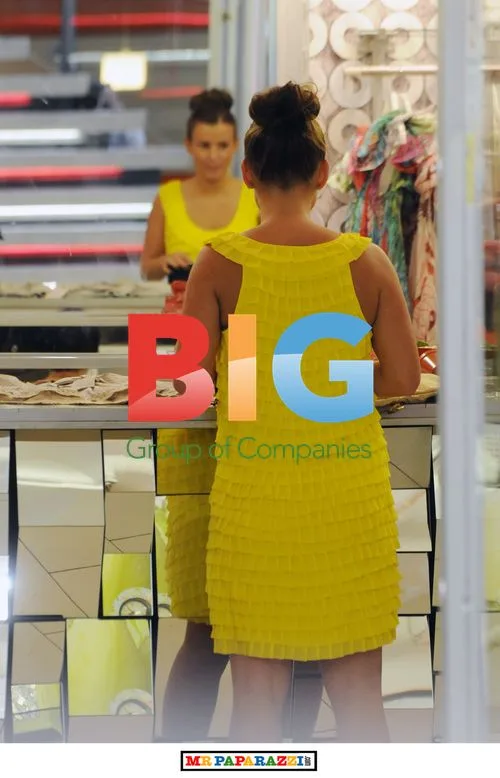 Coleen Rooney shops in yellow dress