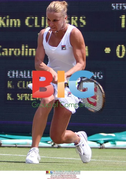 Karolina Sprem Returns Ball at Wimbledon