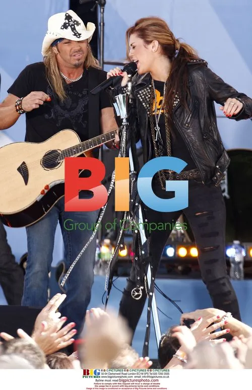 Brett Michaels performs with Miley Cyrus