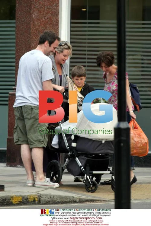 Kim Medcalf out with baby in London