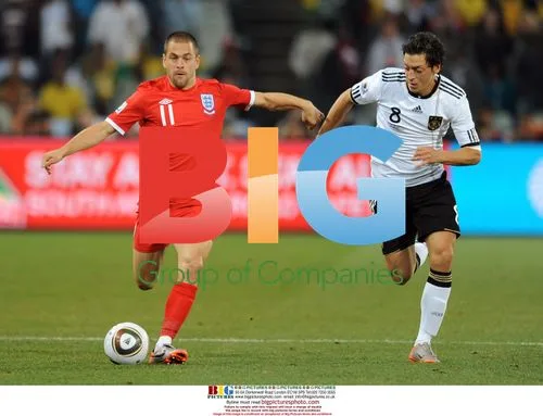 Oezil chases Cole during 2010 World Cup match