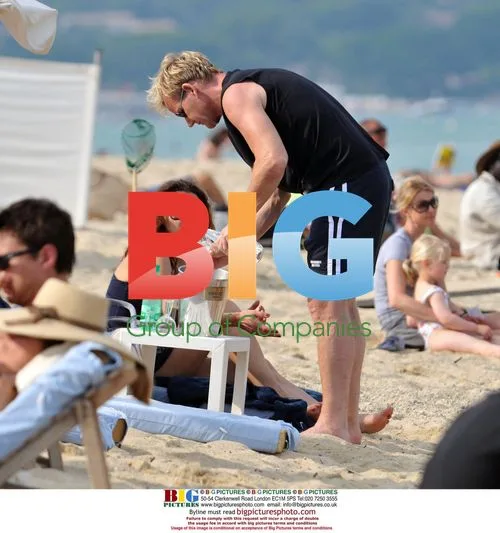 Gordon Ramsay with wife on beach in Saint Tropez