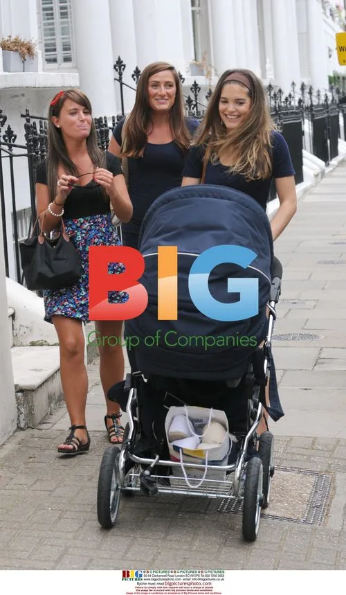 Carly and Joe Cole with baby and friends
