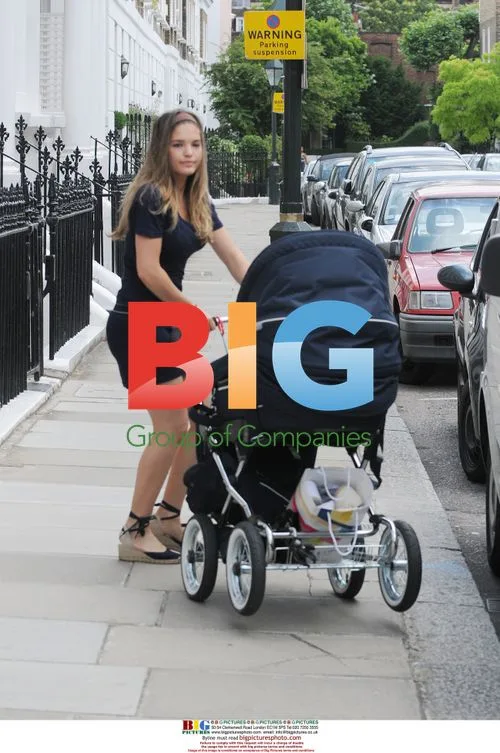 Carly and Joe Cole with baby and friends