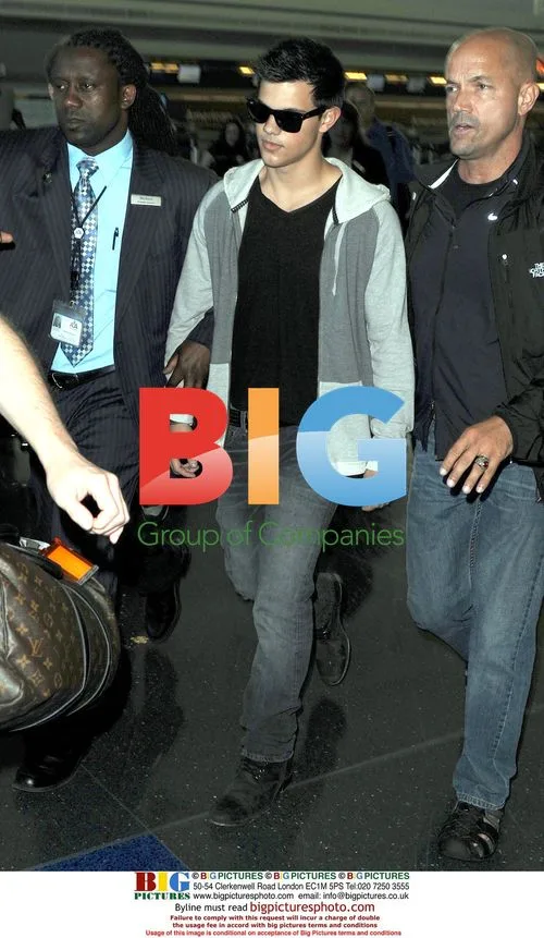 Taylor Lautner Arrives at JFK