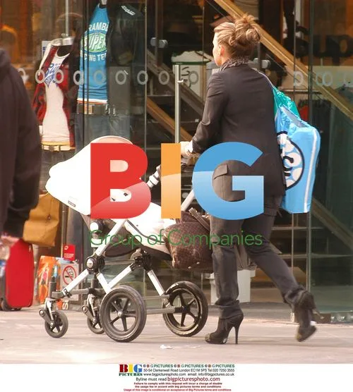 Coleen Rooney out shopping with baby Kai