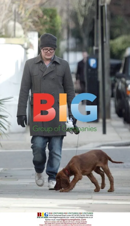 Alan Carr walks his dog