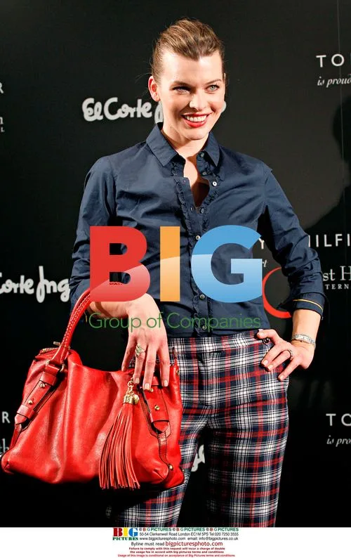 Milla Jovovich promotes Tommy Hilfiger handbag