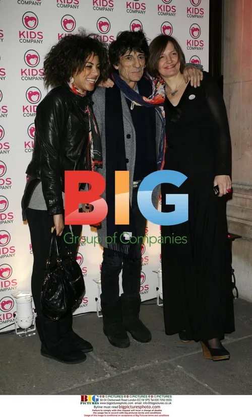 Ronnie Wood and girlfriend at art auction