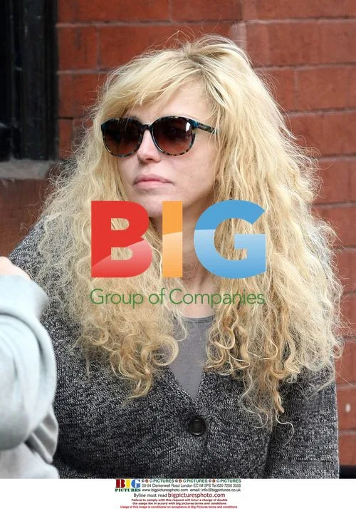 Courtney Love Smokes With Friend in NYC