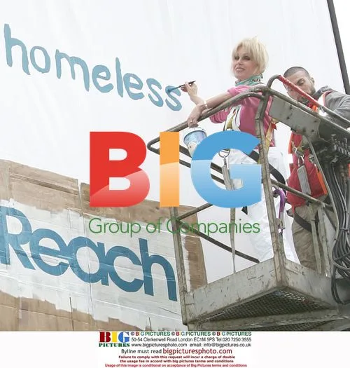 Joanna Lumley paints billboard for Thames Reach