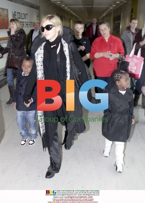 Madonna Arrives at Heathrow with Kids