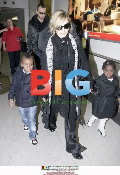 Madonna arrives at Heathrow with children