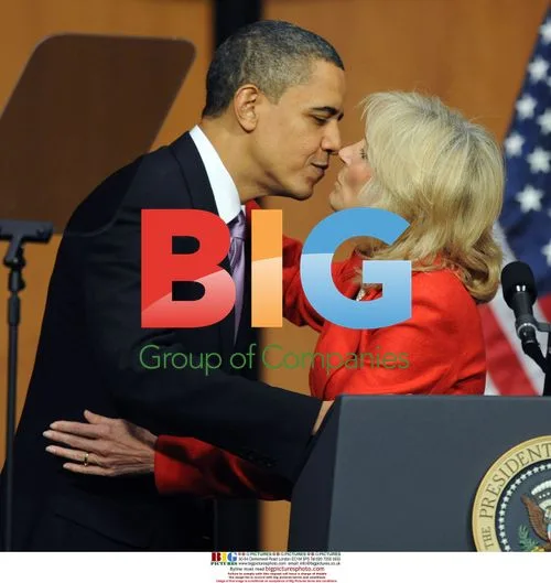 Obama kisses Dr. Jill Biden after health care bill signing