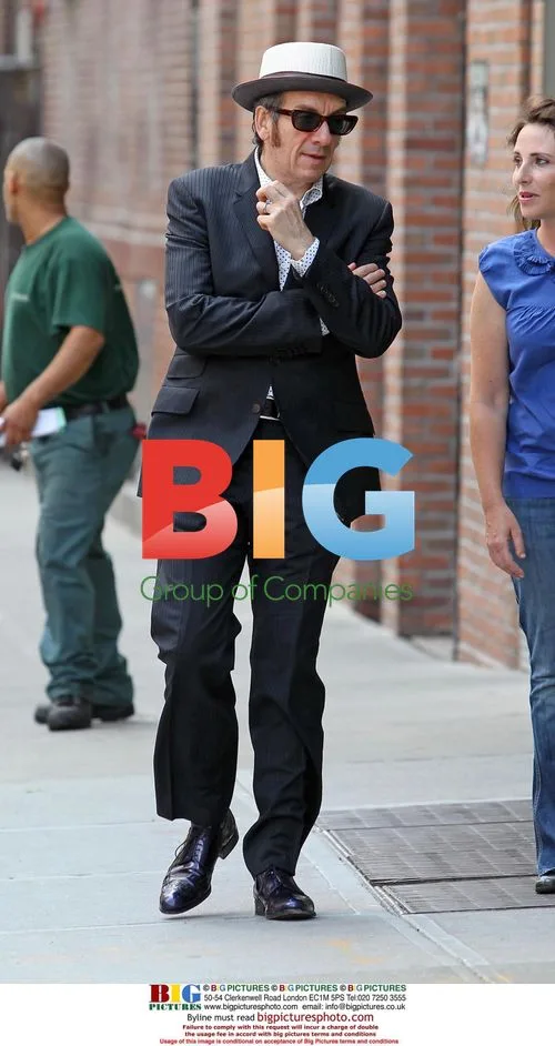 Elvis Costello walking in New York