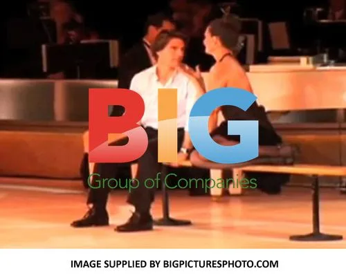 Katie Holmes Serenades Tom Cruise at Charity Gala