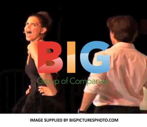 Katie Holmes Serenades Tom Cruise at Charity Gala