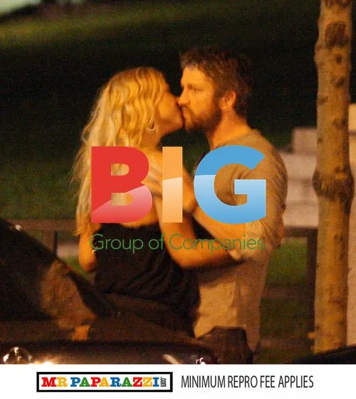 Gerard Butler Enjoys Night Out, Kisses Mystery Woman