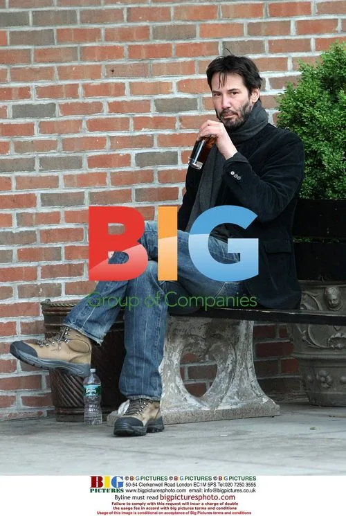 Keanu Reeves Relaxes Outside Hotel
