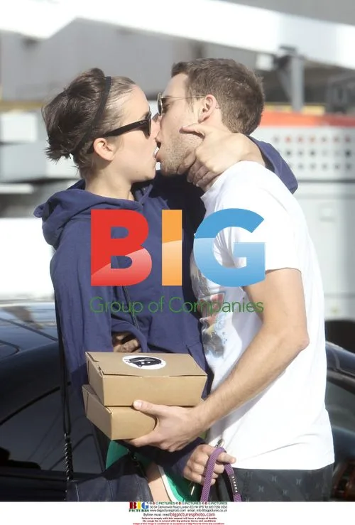 Jessica Stroup and Dustin Milligan Kiss