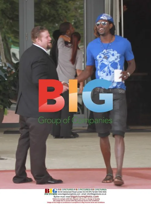 Emmanuel Adebayor walks on Miami Beach
