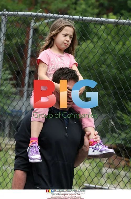 Hugh Jackman carries daughter Ava home from school