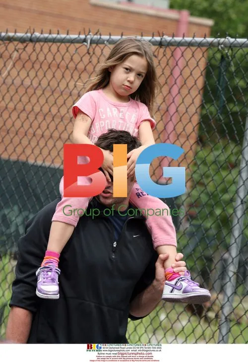 Hugh Jackman carries daughter Ava home from school