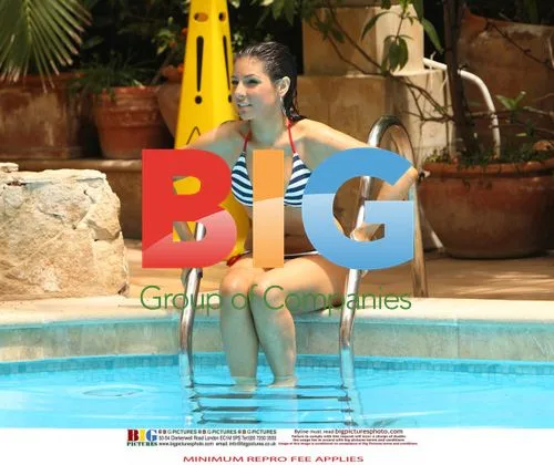 Roxanne Pallette Relaxes Poolside