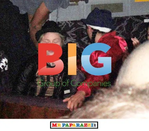 Madonna chats with friend at London club