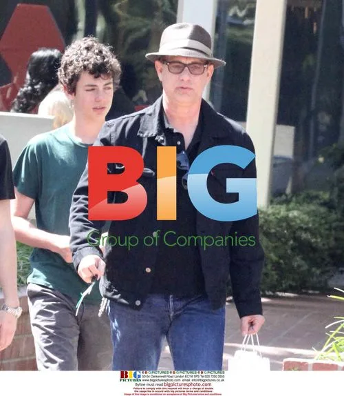 Tom Hanks shops with kids, leaves in electric car