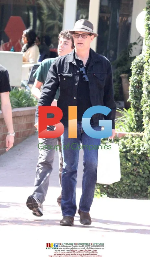 Tom Hanks shops with kids, leaves in green Scion eBox
