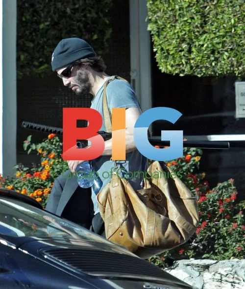 Keanu Reeves Running Errands with Sword